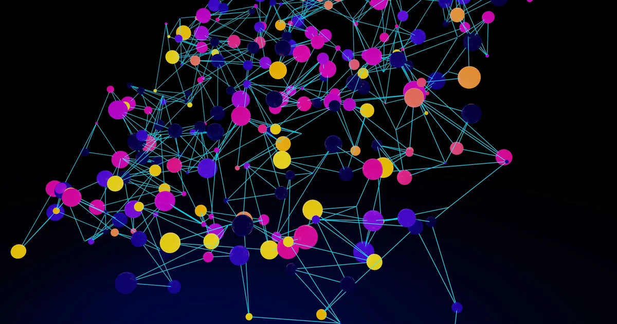 A network of linked colored nodes in magenta, yellow and blue on a black background
