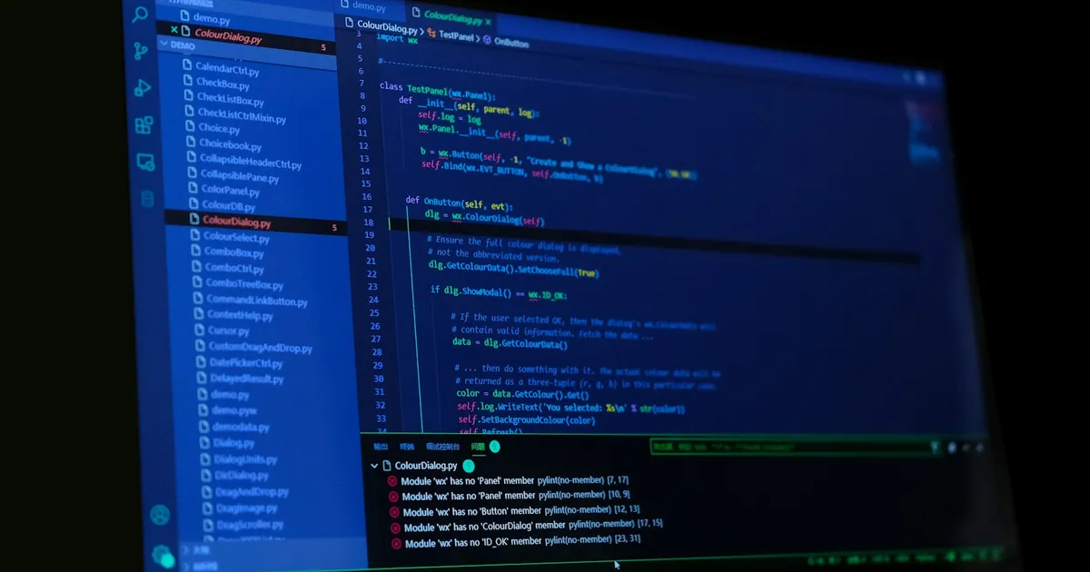 A dark IDE window full of code on a wide monitor