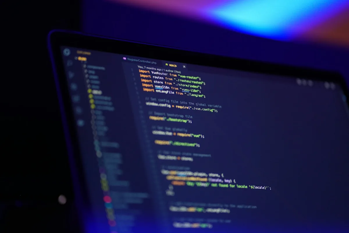 Laptop screen showing colourful syntax-highlighted code