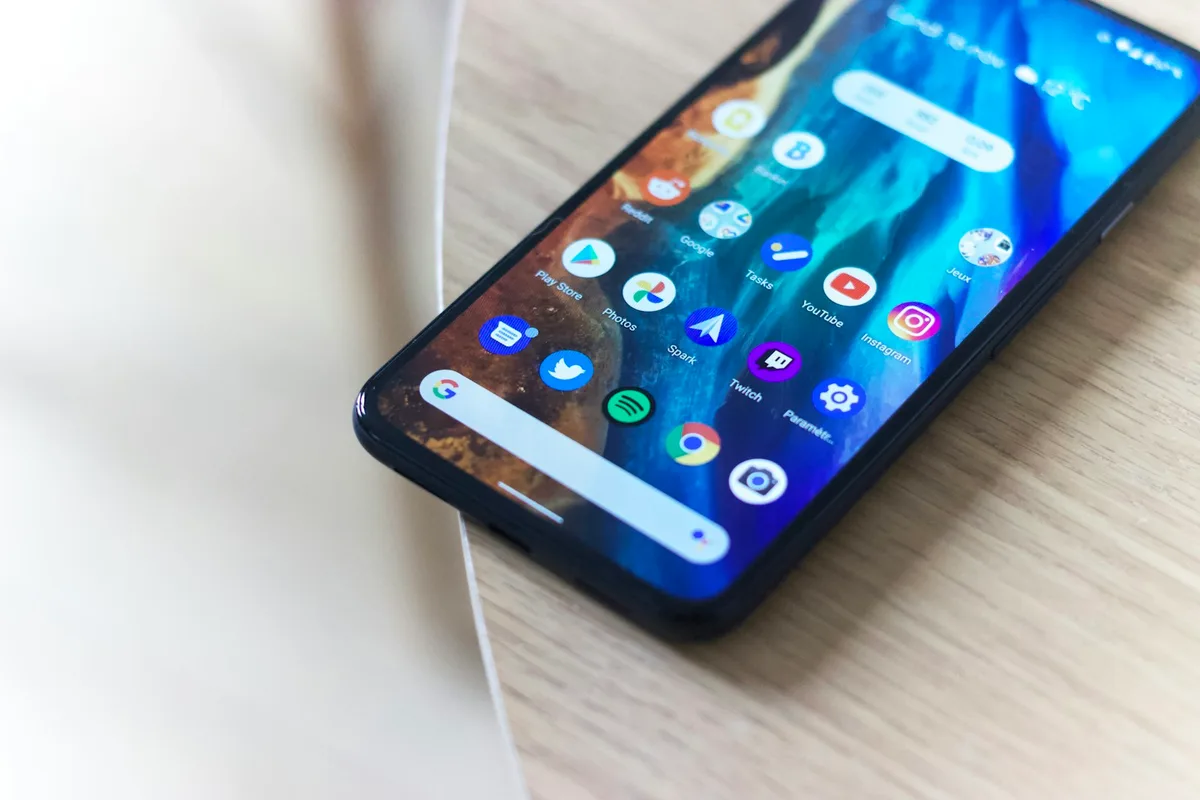 Black Android smartphone on a wooden table