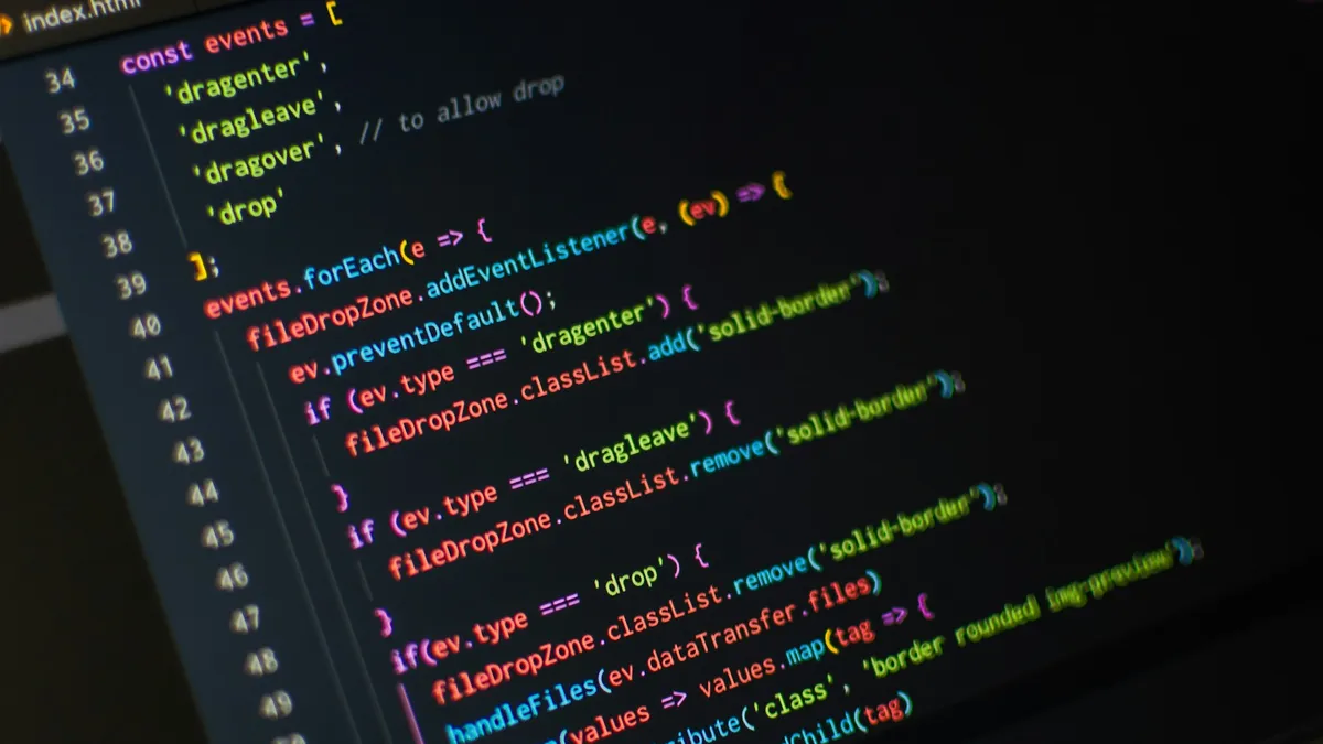 Code editor window filled with JavaScript on a monitor
