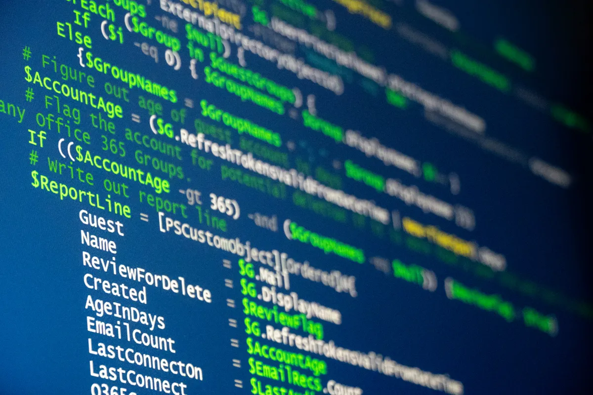 Close view of source code displayed across a wide monitor