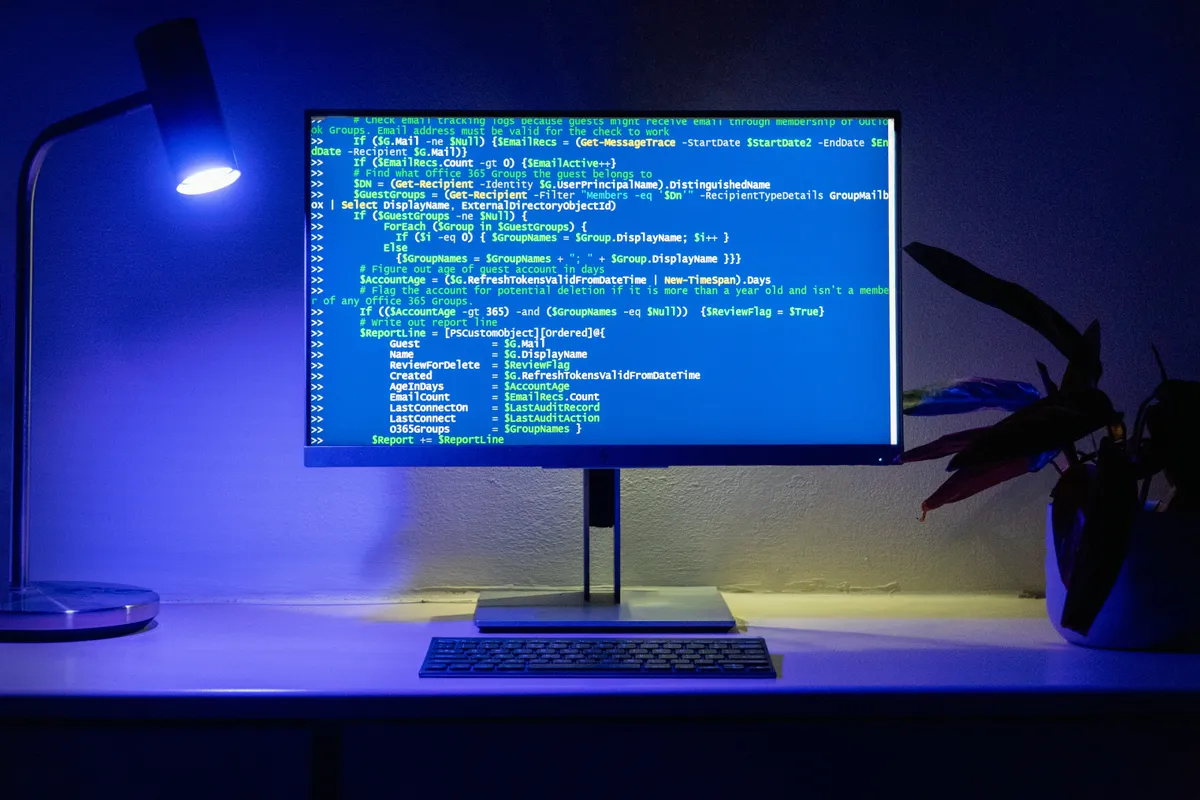 Monitor showing a long run of code in a blue editor theme