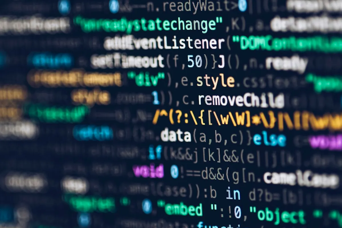 Colorful lines of source code on a dark editor background
