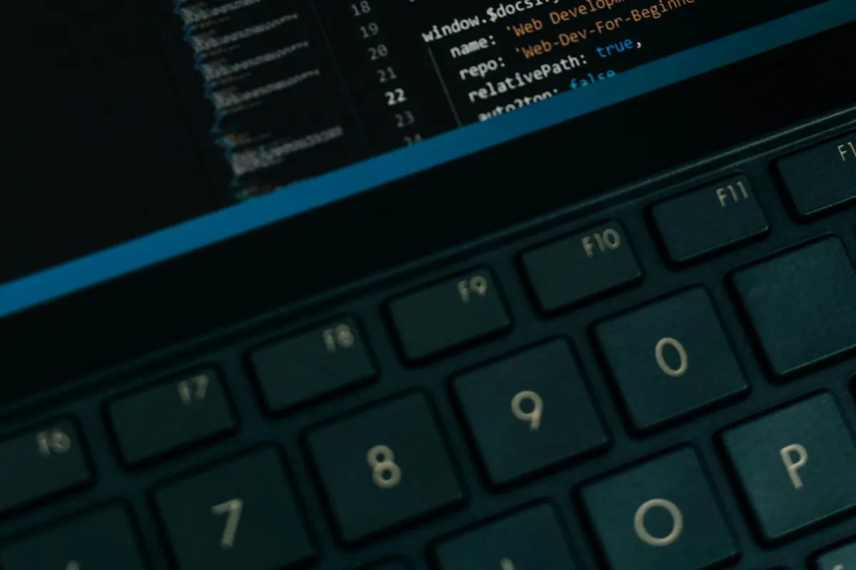 Close-up of a laptop screen displaying lines of source code
