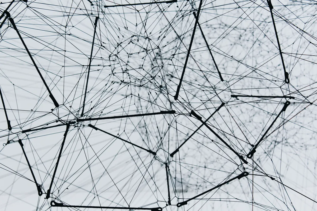 A dense mesh of interconnected metal struts forming a node-like network structure