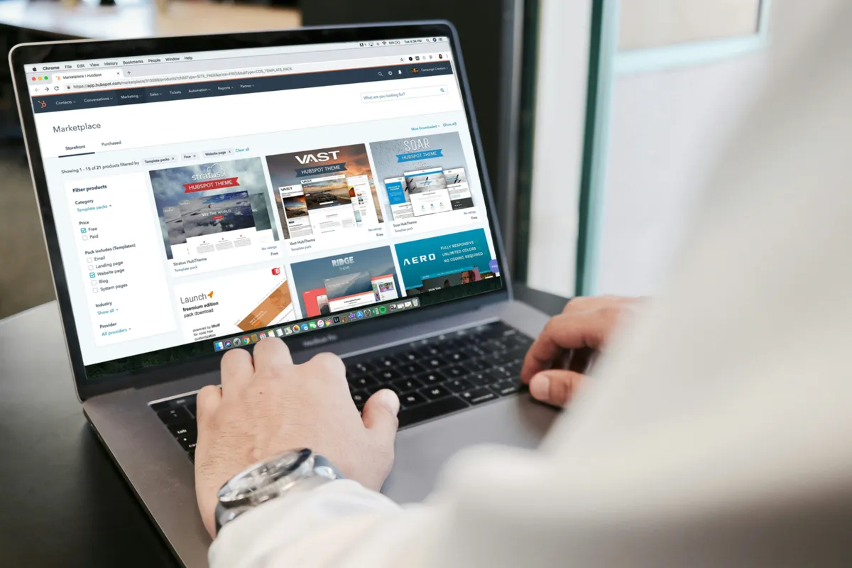 Person browsing a website on a MacBook Pro laptop