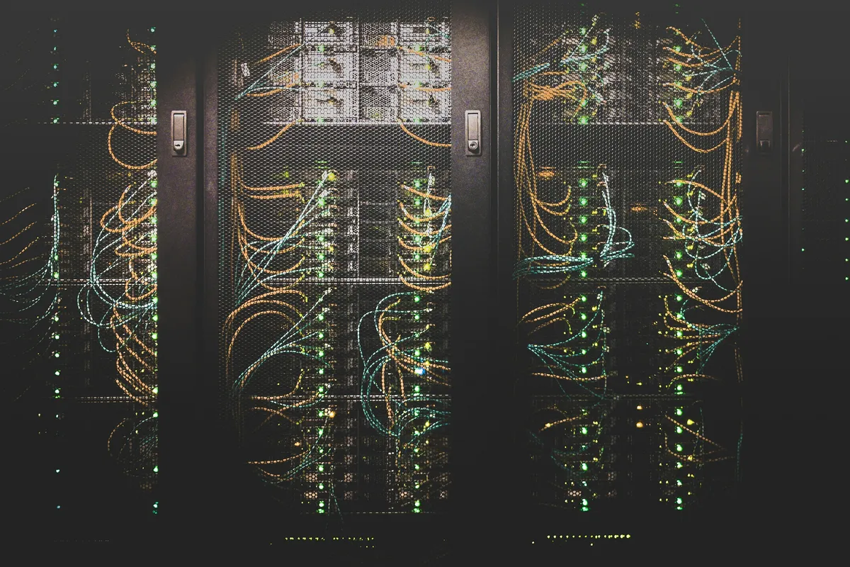 Blue fiber optic cables patched into a server rack switch