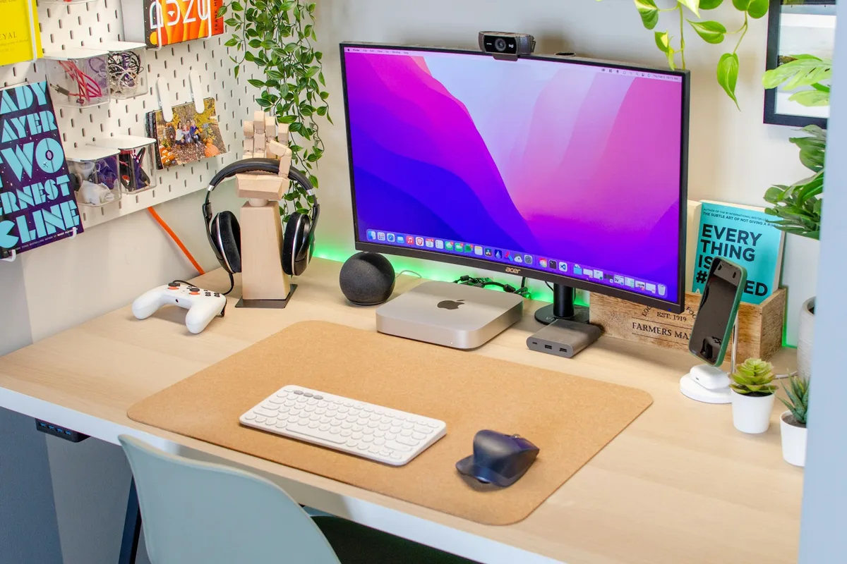 A desktop computer on a wooden desk in a home office